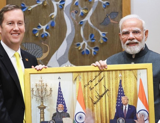 SamacharToday.co.in - नई शुरुआत या बड़ा संकट 500% टैरिफ खतरे के बीच अमेरिकी राजदूत सर्जियो गोर दिल्ली पहुंचे - Image Credited by Times NOW